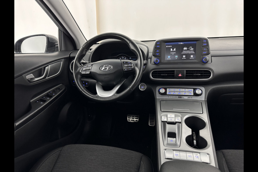 Hyundai Kona EV Comfort 39 kWh [ 3-Fase-11kW] (INCL-BTW) *DIGI-COCKPIT | ADAPTIVE-CRUISE | CARPLAY | DAB | LANE-ASSIST | KEYLESS | COMFORT-SEATS | CCS-FASTLOADER | SHIFTPADDLES | 17"ALU*