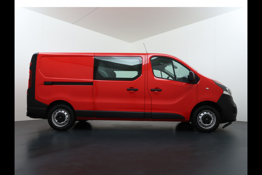Opel Vivaro D126PK Dubbele Cabine 5-Persoons L2H1 Euro 6 Trekhaak Camera Navi Airco Cruise Control Pdc 1.6CDTI Betonplex Vloer Schuifdeur Achterdeuren Regen-Lichtsensor 1e Eigenaar Origineel Nederlandse Auto Dealeronderhouden 2.000kg trekvermogen