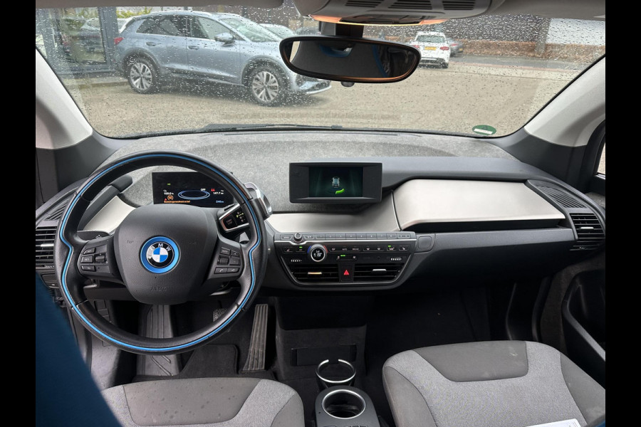 BMW i3 Basis 120Ah 42 kWh SOH 100% | 3-FASE LADER | WARMTEPOMP | ORIGINEEL NL AUTO MET NAP | DEALER ONDERHOUDEN | STOELVERWARMING | CAMERA | 12 MND BOVAG GARANTIE