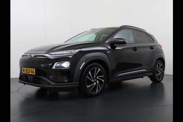 Hyundai Kona EV 64kWh 204pk SOH 100% Premium Schuif-/Kanteldak Leer Warmtepomp Head-Up Display Apple Carplay Android Navi Camera Elektr.Stoel Pdc Subwoofer Bluetooth Dodehoek detector Privacy Glas Rijstrooksensor 1e Eigenaar Origineel Nederlandse Auto Volledig Dealeronderhouden