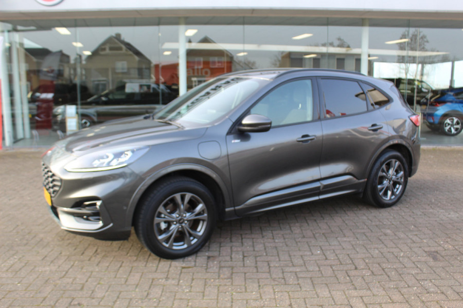 Ford Kuga 2.5-225pk Plug-in Hybrid ST-Line X. Hybride rijden voor een reële prijs ! Adaptive Cruise Control, Stoel-, achterbank, stuur- en voorraamverwarming, autm. airco dual, camera v+a, elektr. achterklep, side- en lane assist etc.