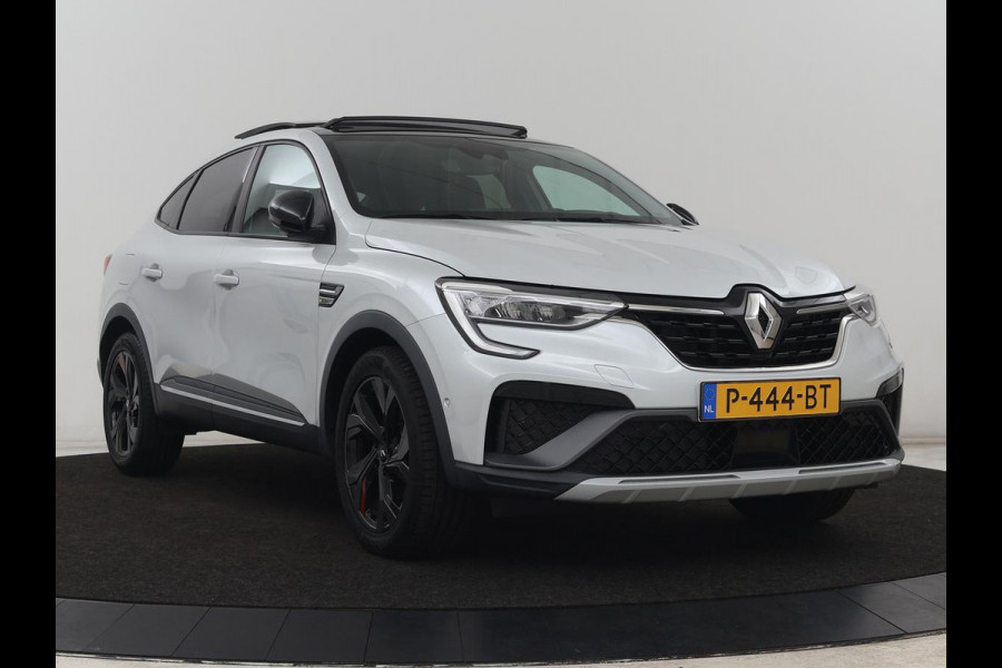 Renault Arkana 1.6 E-Tech Hybrid 145 R.S. Line | Panoramadak | Leder/Alcantara | Trekhaak | Stoelverwarming | Adaptive cruise | Camera | Carplay | Keyless | Park Assist | Full LED | Navigatie | Stuurverwarming