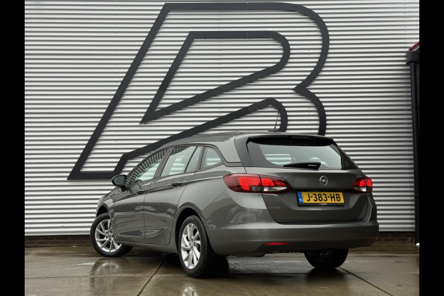 Opel Astra Sports Tourer 1.2 Business Edition 2e Eigenaar,Apple Carplay,Airco,Camera,Cruise,PDC,Trekhaak,N.A.P,APK tot 07-2026