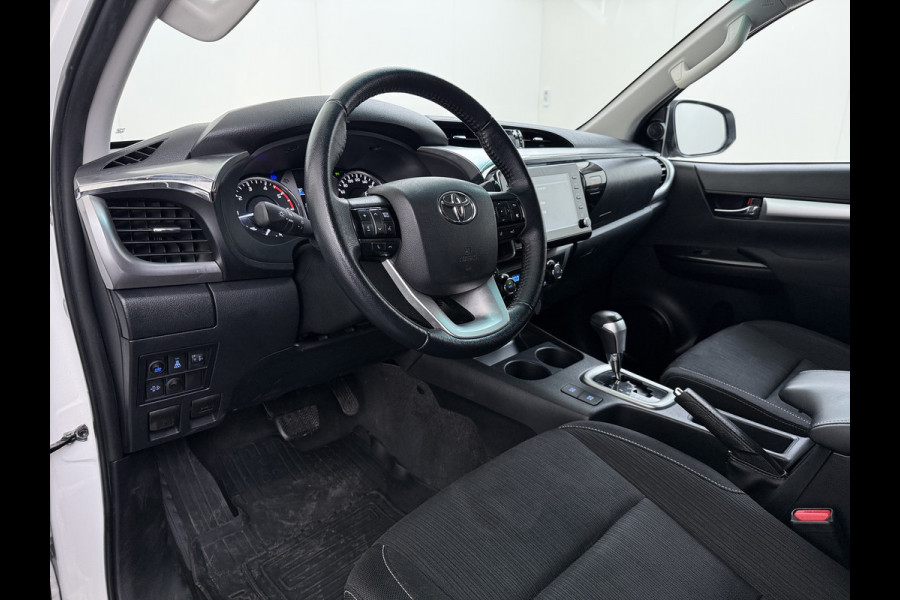 Toyota Hilux 2.4 D-4D 4WD AUT-6 Double Cab Professional Lier Canopy Hardtop (Huif) Trekhaak Navi* via Apple Carplay Android Auto Ecc Camera A Lane Assist Inbouw Kasten Bluetooth AWD EURO6 400Nm *3.500kg Trekvermogen* 1e Eigenaar Dealeronderhouden Origineel Nederlandse Auto