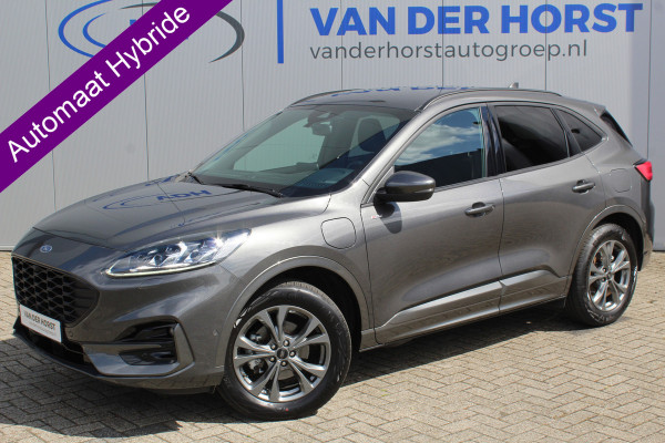 Ford Kuga 2.5-225pk Plug-in Hybrid ST-Line X. Hybride rijden voor een reële prijs ! Autm. airco dual, side- en lane assist, adaptieve cruise cntrl, camera v+a, stoel- en voorraamverw., elektr. achterklep, metallic lak, navigatie, telefoonvoorb.