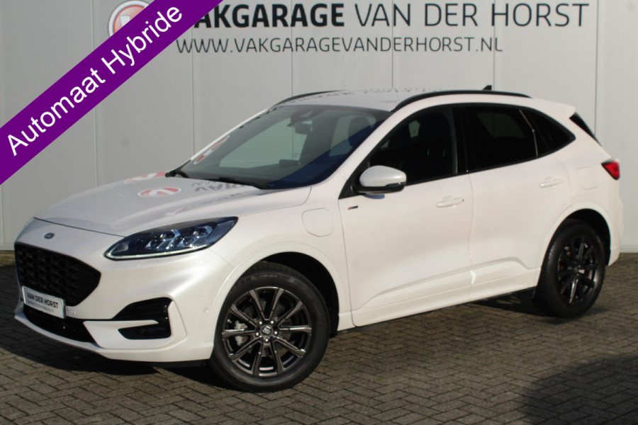 Ford Kuga 2.5-225pk Plug-in Hybrid ST-Line X. Hybride rijden voor een reële prijs ! Autm. airco dual, side- en lane assist, adaptieve cruise cntrl, camera v+a, stoel-, stuur- en voorraamverw., elektr. achterklep, metallic lak, navigatie, telefoonvoorb. etc.