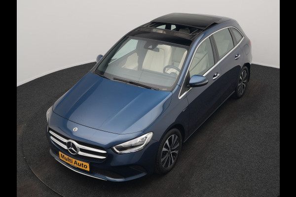 Mercedes-Benz B-Klasse 250 e Progressive PHEV 218pk Dealer O.H. | Trekhaak Af Fabriek | Panodak | Camera | Lederen Sportstoelen Memory & Verwarmd | Apple Carplay | Keyless | Cruise Control | Navigatie | DAB | Plug In Hybrid