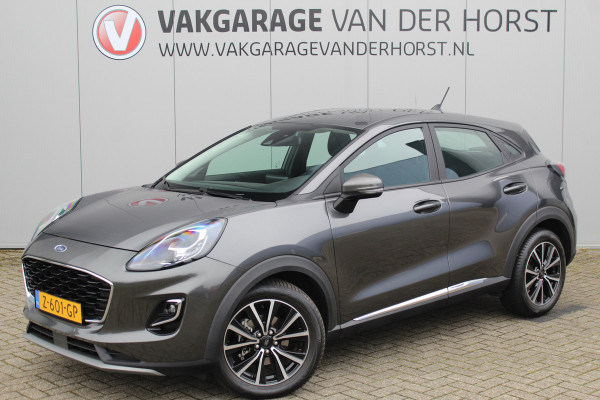 Ford Puma 1.0-125pk EcoBoost Mild-Hybrid Titanium. Fabrieksgarantie t/m 21-05-2027 ! Slechts 14.800km ! Volautm. airco, pdc achter, all season banden, stoel-, stuur- en voorraamverw., navigatie, telefoonvoorb., elektr. achterklep, cruise cntrl, keyless entry&go etc.