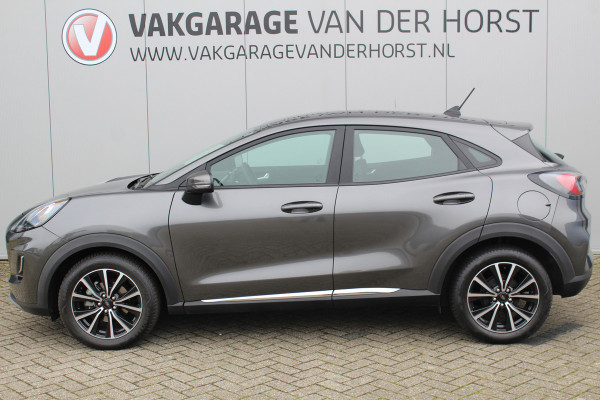 Ford Puma 1.0-125pk EcoBoost Mild-Hybrid Titanium. Fabrieksgarantie t/m 21-05-2027 ! Slechts 14.800km ! Volautm. airco, pdc achter, all season banden, stoel-, stuur- en voorraamverw., navigatie, telefoonvoorb., elektr. achterklep, cruise cntrl, keyless entry&go etc.