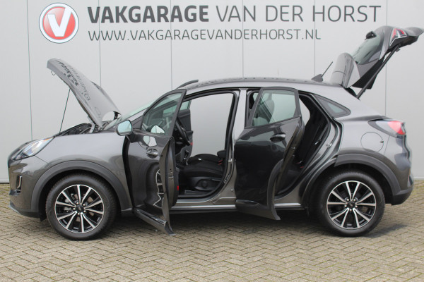 Ford Puma 1.0-125pk EcoBoost Mild-Hybrid Titanium. Fabrieksgarantie t/m 21-05-2027 ! Slechts 14.800km ! Volautm. airco, pdc achter, all season banden, stoel-, stuur- en voorraamverw., navigatie, telefoonvoorb., elektr. achterklep, cruise cntrl, keyless entry&go etc.