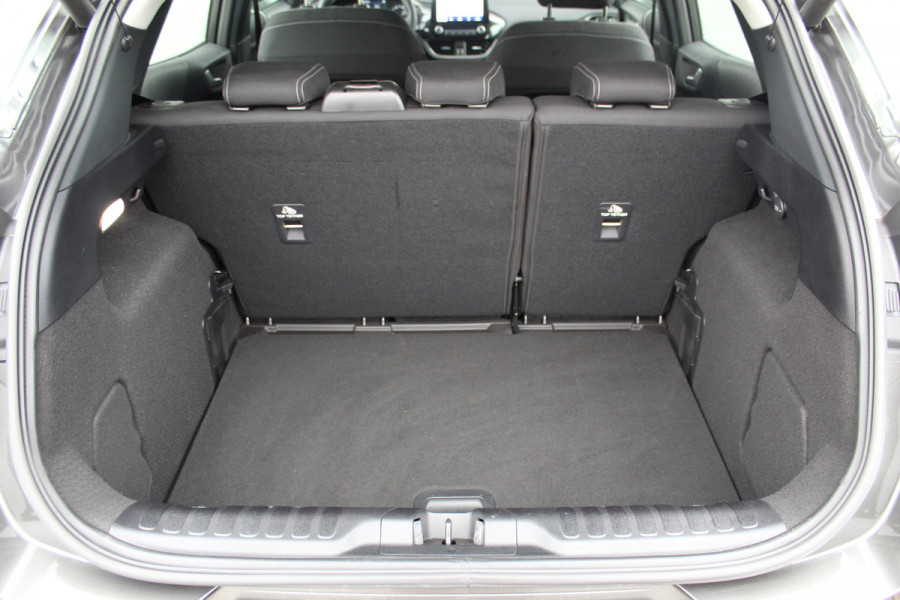 Ford Puma 1.0-125pk EcoBoost Mild-Hybrid Titanium. Fabrieksgarantie t/m 21-05-2027 ! Slechts 14.800km ! Volautm. airco, pdc achter, all season banden, stoel-, stuur- en voorraamverw., navigatie, telefoonvoorb., elektr. achterklep, cruise cntrl, keyless entry&go etc.