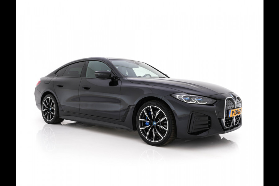 BMW i4 eDrive40 High Executive 84 kWh M-Sportpack [ 3-Fase-11kW ] {SOH-93%} (INCL.BTW)  Aut *LEATHER | HEAD UP | FULL-LED | HIFI-SOUND | CRUISE | WIDESCREEN-COCKPIT | DAB+ | CAMERA | AMBIENTLIGHT | CARPLAY | HEATED-SPORTSEATS | PRIVACY-GLASS | 19''ALU*