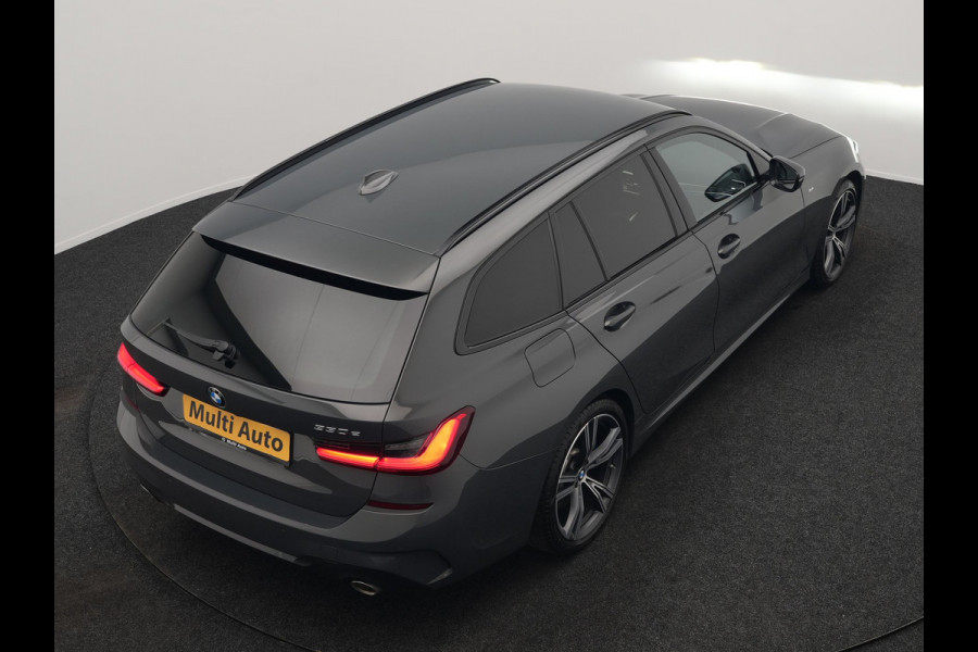 BMW 3 Serie Touring 330e M Sport PHEV 293pk Dealer O.H. | Trekhaak Af Fabriek | Head Up | Adaptive Cruise | Laser LED | Harman / Kardon | Camera | Adaptief Onderstel | Alcantara Sportstoelen Verwarmd | Keyless | Blis | Sfeerverlichting | Dravitgrau metallic | Plug In Hybrid
