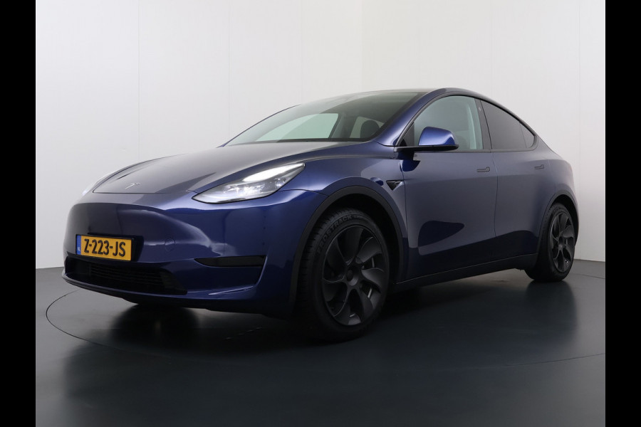 Tesla Model Y RWD 300pk Trekhaak SOH 92% Warmtepomp LFP-Accu Leer Lmv Camera's Panoramadak Adap.Cruise Navi Ecc Autopilot Stoel+Stuur+Achterbank Verwarming Elek.Achterklep Dodehoek detector Draadloze telefoonlader 1e Eigenaar 1.600KG Trekgewicht Fabrieksgarantie op Motor en Accu tot 22-04-2032/160.000km