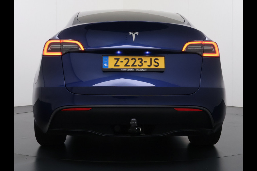 Tesla Model Y RWD 300pk Trekhaak SOH 92% Warmtepomp LFP-Accu Leer Lmv Camera's Panoramadak Adap.Cruise Navi Ecc Autopilot Stoel+Stuur+Achterbank Verwarming Elek.Achterklep Dodehoek detector Draadloze telefoonlader 1e Eigenaar 1.600KG Trekgewicht Fabrieksgarantie op Motor en Accu tot 22-04-2032/160.000km