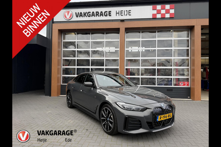 BMW i4 eDrive40 84 kWh | M-Pakket | Schuifdak | Dravitgrau metallic | NL-Auto |