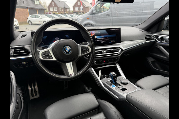 BMW i4 eDrive40 84 kWh | M-Pakket | Schuifdak | Dravitgrau metallic | NL-Auto |