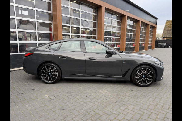 BMW i4 eDrive40 84 kWh | M-Pakket | Schuifdak | Dravitgrau metallic | NL-Auto |