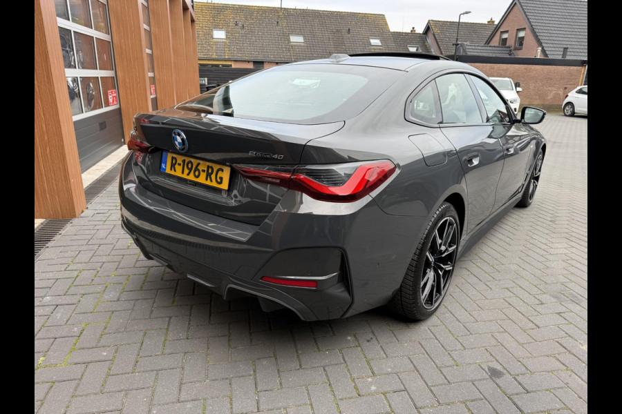 BMW i4 eDrive40 84 kWh | M-Pakket | Schuifdak | Dravitgrau metallic | NL-Auto |