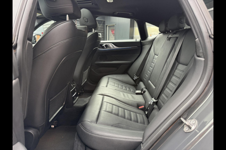 BMW i4 eDrive40 84 kWh | M-Pakket | Schuifdak | Dravitgrau metallic | NL-Auto |