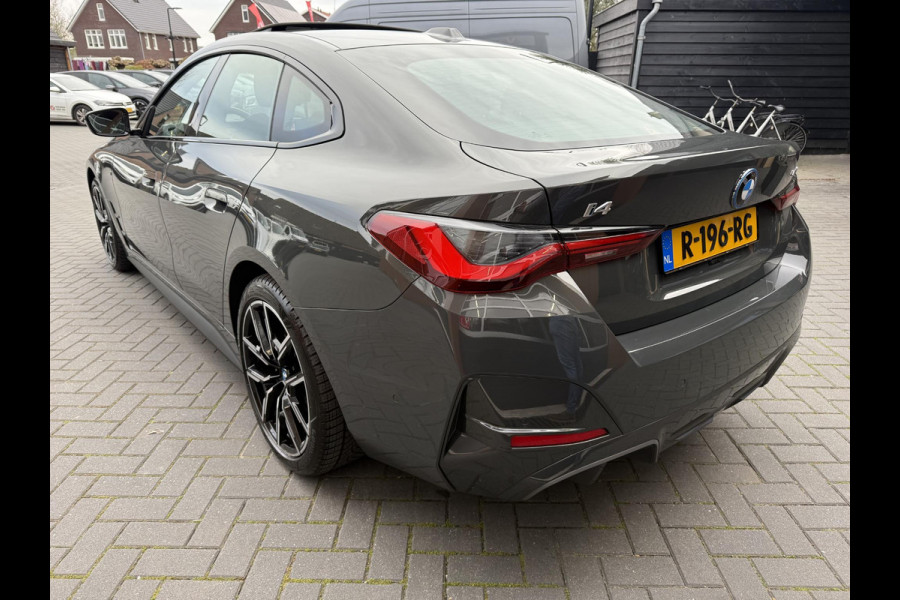 BMW i4 eDrive40 84 kWh | M-Pakket | Schuifdak | Dravitgrau metallic | NL-Auto |
