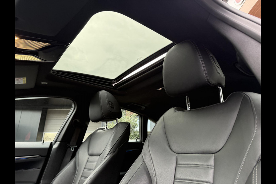 BMW i4 eDrive40 84 kWh | M-Pakket | Schuifdak | Dravitgrau metallic | NL-Auto |