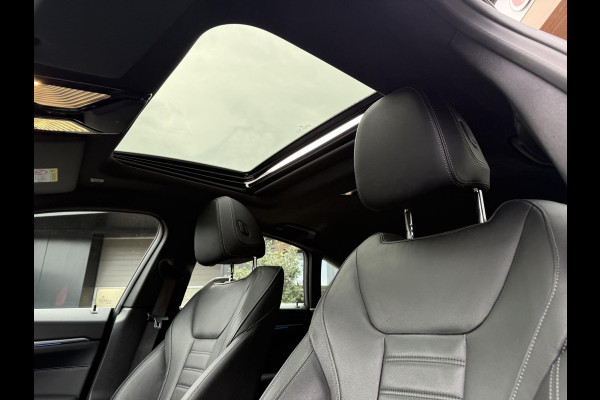 BMW i4 eDrive40 84 kWh | M-Pakket | Schuifdak | Dravitgrau metallic | NL-Auto |