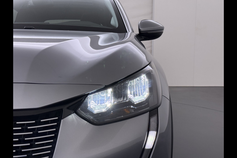 Peugeot e-208 EV SOH 92,5% Panoramadak Stoelverwarming 3D-Navi 360°Camera Apple Carplay Android Auto Ecc Cruise Control Pdc Keyless 50kWh Allu Led Lmv Privacy Glas Isofix DAB+ Bluetooth Regen-Lichtsensor Lane Assist Dealeronderhouden Origineel Nederlandse Auto