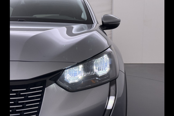 Peugeot e-208 EV SOH 92,5% Panoramadak Stoelverwarming 3D-Navi 360°Camera Apple Carplay Android Auto Ecc Cruise Control Pdc Keyless 50kWh Allu Led Lmv Privacy Glas Isofix DAB+ Bluetooth Regen-Lichtsensor Lane Assist Dealeronderhouden Origineel Nederlandse Auto