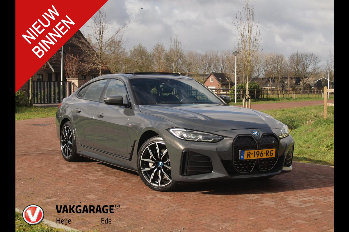 BMW i4 eDrive40 84 kWh | M-Pakket | Schuifdak | Camera | Dravitgrau metallic | NL-Auto |
