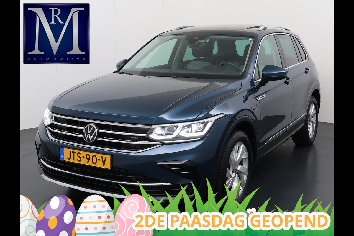 Volkswagen Tiguan 1.4 TSI eHybrid PHEV VAN €33.900,- NU VOOR SLECHTS €30.877,- Uw LENTEVOORDEEL €3.023,- |SUPER COMPLEET| SCHUIF/ KANTELDAK| DODE HOEK| ELEK. ACHTERKLEP| DIG. DASH | CAMERA| RIJKLAAR GELEVERD INCL. 12 MND BOVAG GARANTIE
