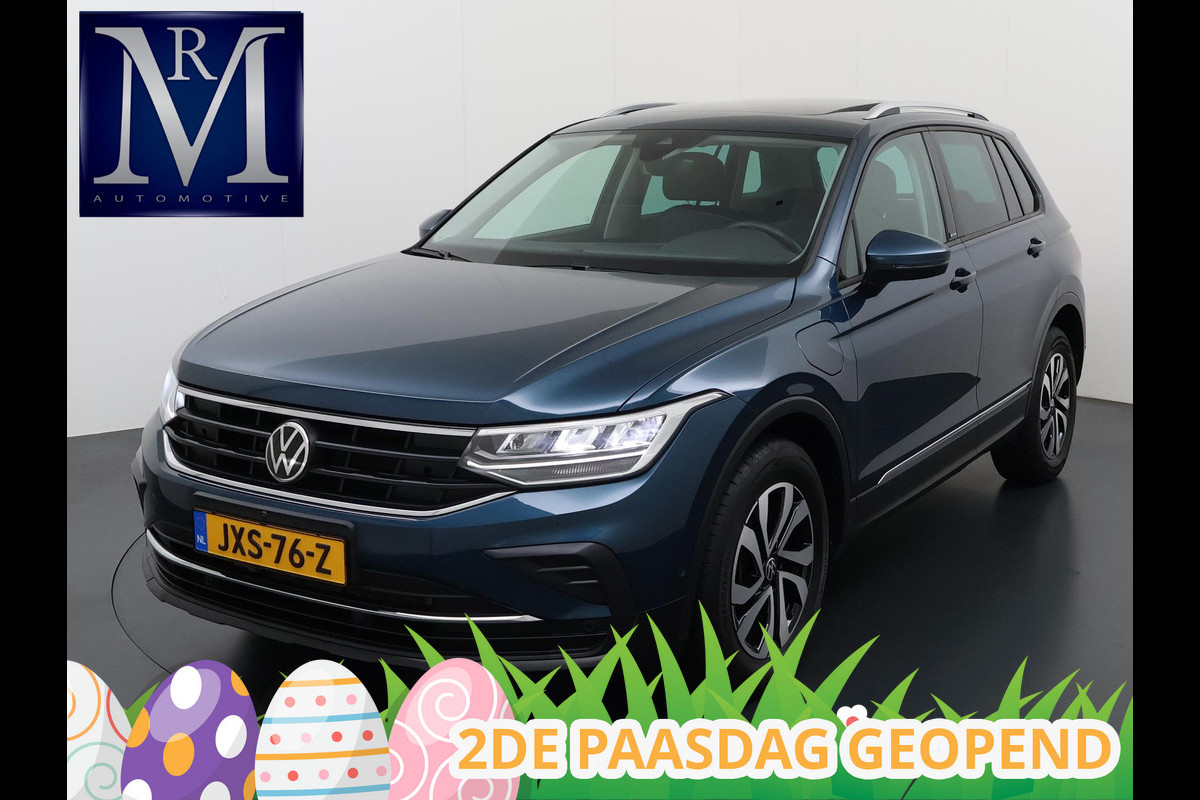 Volkswagen Tiguan 1.4 TSI eHybrid PHEV VAN €32.900,- NU VOOR SLECHTS €29.877,- Uw LENTEVOORDEEL €3.023,- |ADAPTIVE CRUISE CONTROL| PANO| STOEL + STUURVERWARMING| 360 CAMERA| PARKEER ASSISTENT| RIJKLAARPRIJS INCL. 12 MND BOVAG GARANTIE