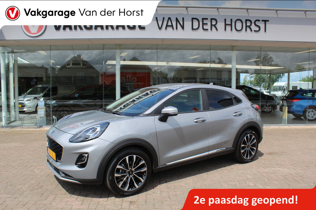 Ford Puma 1.0-125pk EcoBoost Mild-Hybrid Titanium X. Garantie t/m 07-03-2028 ! Slechts 7.400km ! Cruise cntrl, climate cntrl, stoel-, stuur- en voorraamverw., draadloos opladen telefoon, trekhaak afneembaar, navigatie, telefoonvoorb., LM wielen, B&O soundsyst., digitaal dashboard etc.