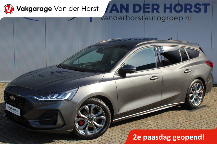 Ford FOCUS Wagon 1.0-125pk EcoBoost ST-Line X. Geweldig mooie, luxe en sportieve Focus wagon ! Slechts 12.000km ! Autm. airco, stoel-, stuur- en voorraamverw., ergonomische stoelen, adaptieve cruise cntrl, side- en lane assist, elektr. panodak, B&O soundsyst., etc.