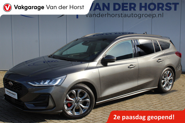 Ford FOCUS Wagon 1.0-125pk EcoBoost ST-Line X. Geweldig mooie, luxe en sportieve Focus wagon ! Slechts 12.000km ! Autm. airco, stoel-, stuur- en voorraamverw., ergonomische stoelen, adaptieve cruise cntrl, side- en lane assist, elektr. panodak, B&O soundsyst., etc.