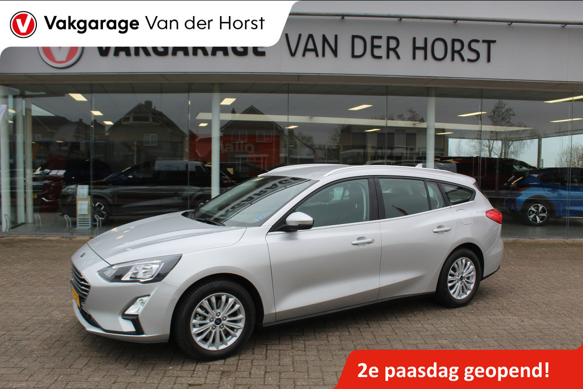 Ford FOCUS Wagon 1.0-125pk EcoBoost Mild-hybrid Titanium. Mooie, ruime, luxe en comfortabele Ford Focus wagon. Volautm. airco dual, camera, easy entry/easy go, stoel-, stuur- en voorraamverw., cruise control, Isofix, side- en lane assist, parkeersensoren v+a, LM wielen etc.