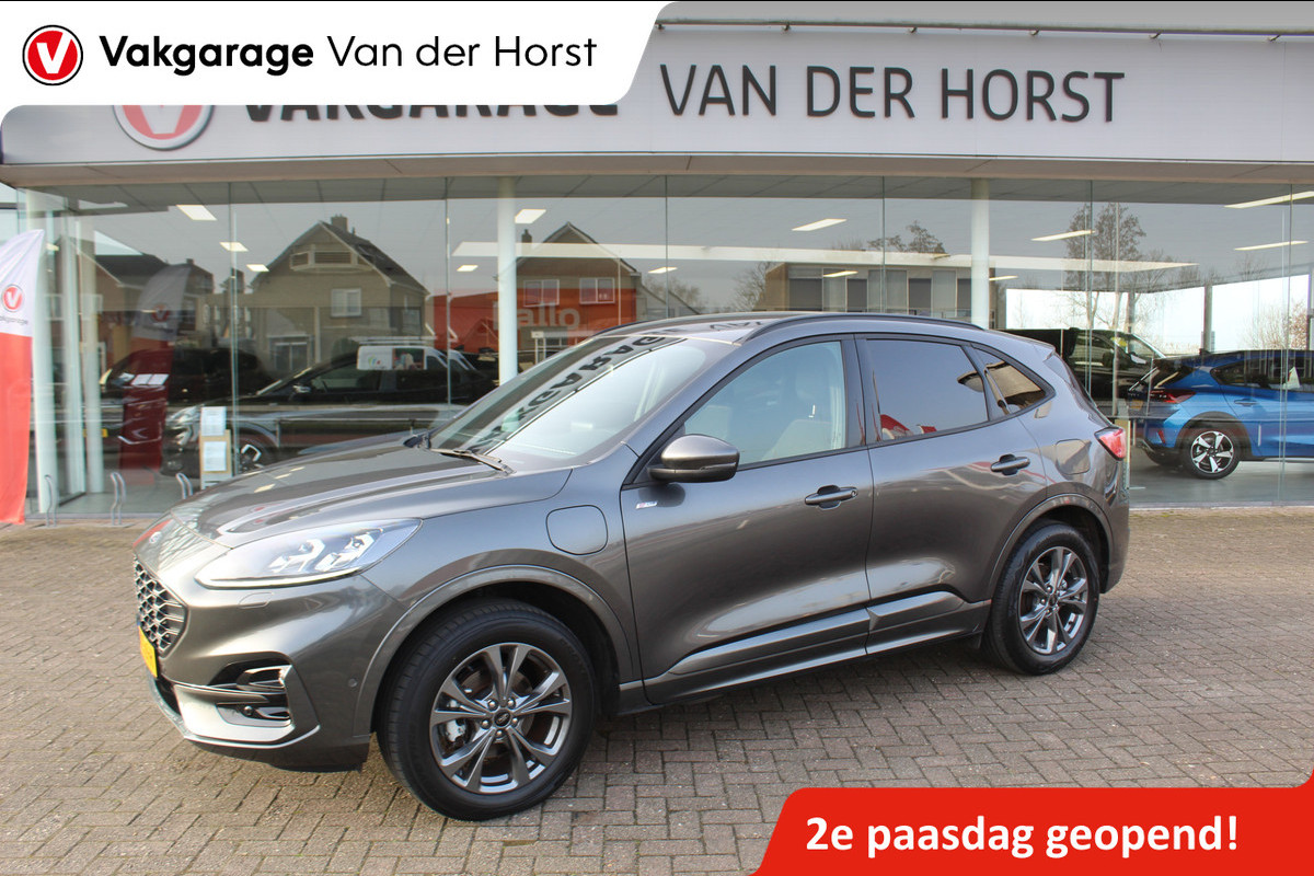 Ford Kuga 2.5-225pk Plug-in Hybrid ST-Line X. Hybride rijden voor een reële prijs ! Adaptive Cruise Control, Stoel-, achterbank, stuur- en voorraamverwarming, autm. airco dual, camera v+a, elektr. achterklep, side- en lane assist etc.