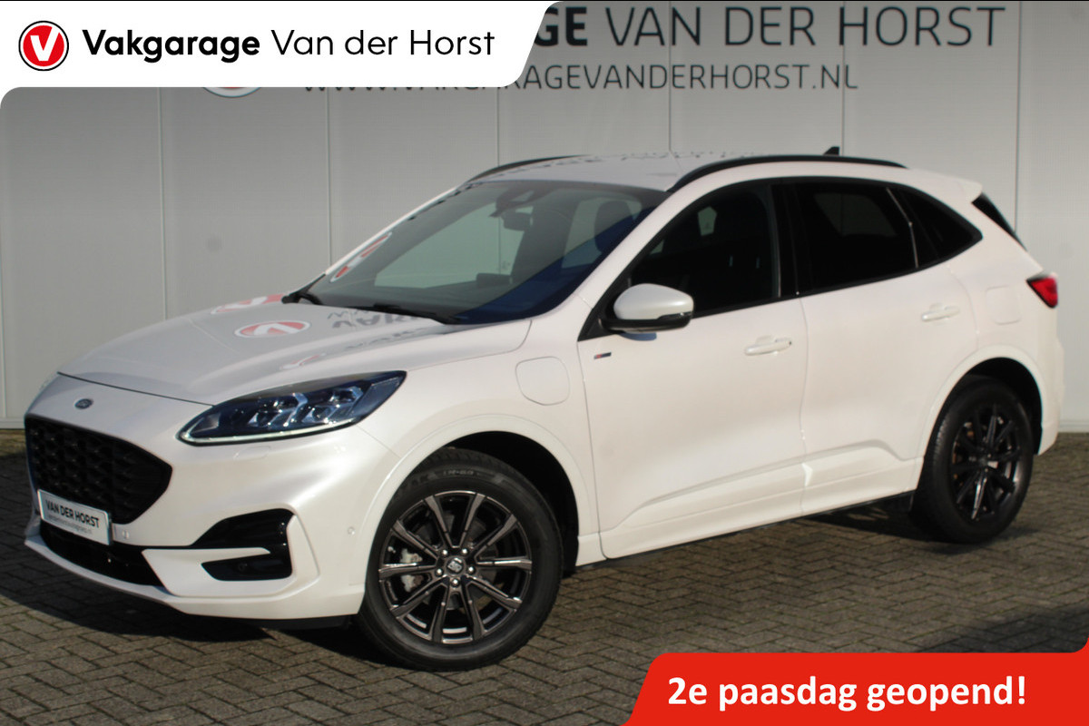Ford Kuga 2.5-225pk Plug-in Hybrid ST-Line X. Hybride rijden voor een reële prijs ! Autm. airco dual, side- en lane assist, adaptieve cruise cntrl, camera v+a, stoel-, stuur- en voorraamverw., elektr. achterklep, metallic lak, navigatie, telefoonvoorb. etc.