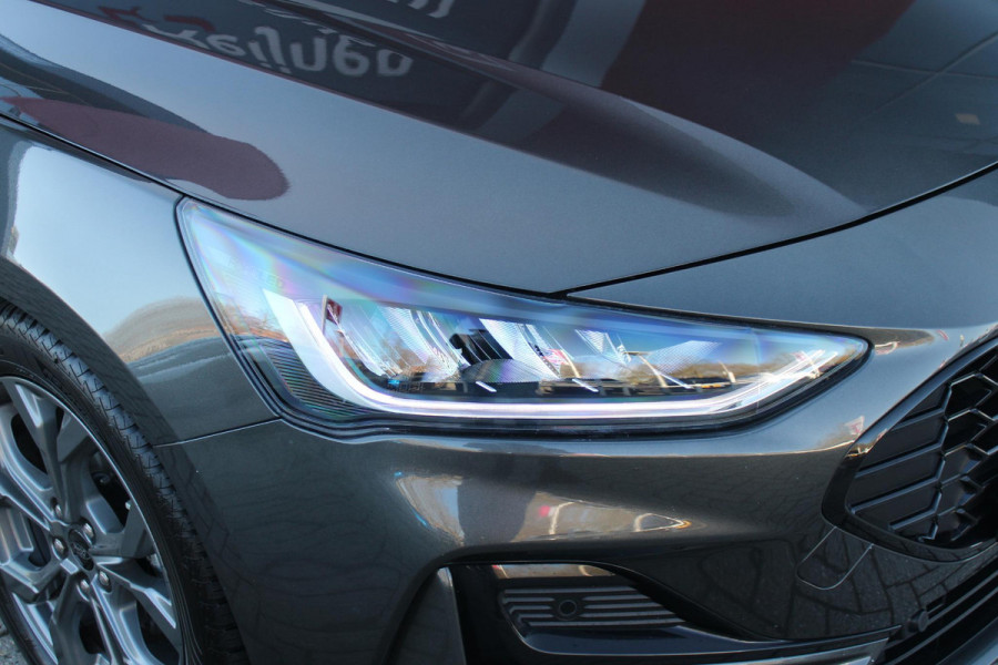 Ford FOCUS Wagon 1.0 155PK AUTOMAAT Hybrid ST LINE | ALL SEASON BANDEN | NAVIGATIE | DRAADLOZE APPLE CARPLAY/ANDROID AUTO | ADAPTIVE CRUISE CONTROL | LANE ASSIST | DODEHOEK DETECTIE | PARKEERSENSOREN VOOR + ACHTER | ACHTERUITRIJ CAMERA | LICHTMETALEN VELGEN 17" | DAB+ RADIO |