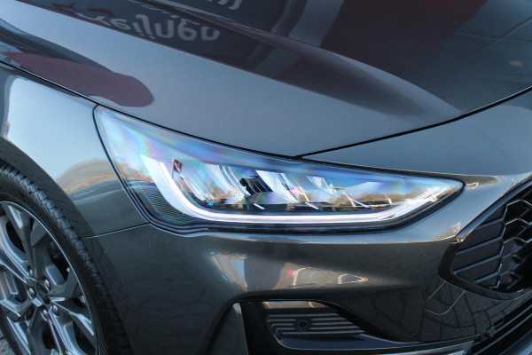 Ford FOCUS Wagon 1.0 155PK AUTOMAAT Hybrid ST LINE | ALL SEASON BANDEN | NAVIGATIE | DRAADLOZE APPLE CARPLAY/ANDROID AUTO | ADAPTIVE CRUISE CONTROL | LANE ASSIST | DODEHOEK DETECTIE | PARKEERSENSOREN VOOR + ACHTER | ACHTERUITRIJ CAMERA | LICHTMETALEN VELGEN 17" | DAB+ RADIO |