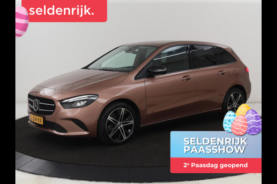 Mercedes-Benz B-Klasse 250e Urban Night | Adaptive cruise | Stoelverwarming | Camera | Carplay | Sfeerverlichting | Half leder | Full LED | Widescreen | Park Assist | Navigatie | PHEV | Plug In