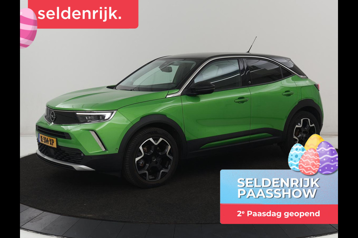 Opel Mokka-e Ultimate 50 kWh | SOH 90% | 3 Fase | Stoelverwarming | Leder/Alcantara | Warmtepomp | Adaptive cruise | Camera | Stuurverwarming | Carplay | Matrix LED | Navigatie | Park Assist