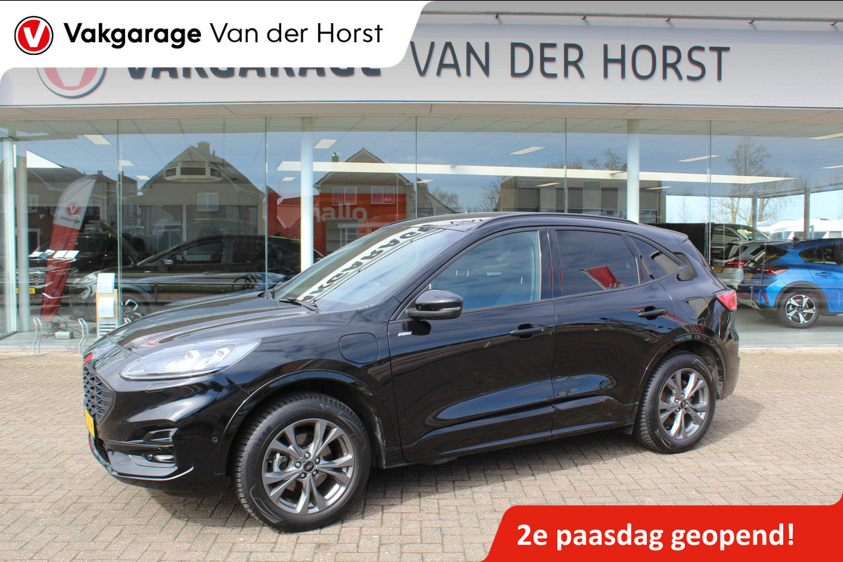 Ford Kuga 2.5-225pk Plug-in Hybrid ST-Line X. Hybride rijden voor een reële prijs ! Adaptive Cruise Control, Stoel- en voorraamverwarming, Climate Control, Metallic lak, Camera v+a, Elektr. achterklep, Side- en lane assist etc.