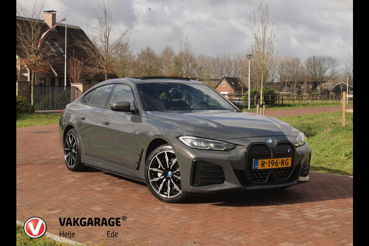 BMW i4 eDrive40 84 kWh | M-Pakket | Schuifdak | Camera | Dravitgrau metallic | NL-Auto |