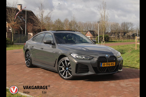 BMW i4 eDrive40 84 kWh | M-Pakket | Schuifdak | Camera | Dravitgrau metallic | NL-Auto |