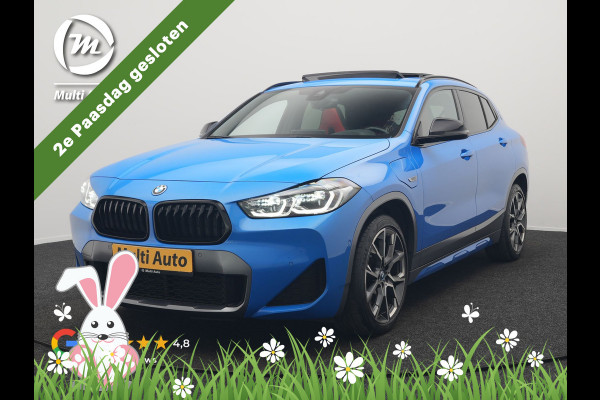 BMW X2 xDrive25e M Sport PHEV 220pk Dealer O.H. | Trekhaak Afn. | Panodak | Adaptive Cruise | Head Up | Camera | Harman / Kardon | Lederen Competition Stoelen Memory & Verwarmd | Keyless | 19"L.M | Sfeerverlichting | Navigatie | DAB | Plug