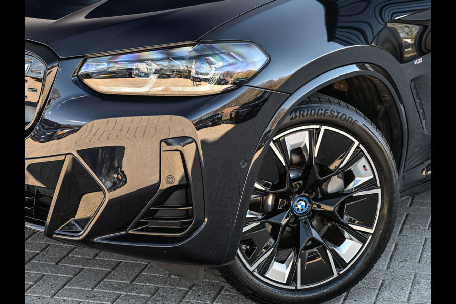 BMW iX3 High Executive 80 kWh M-Sport | Soh 100% | Facelift | Panoramadak | Comfort access | Trekhaak | Shadow-line | Sport seats | Active cruise | 360 camera | Head-up | Harman/Kardon