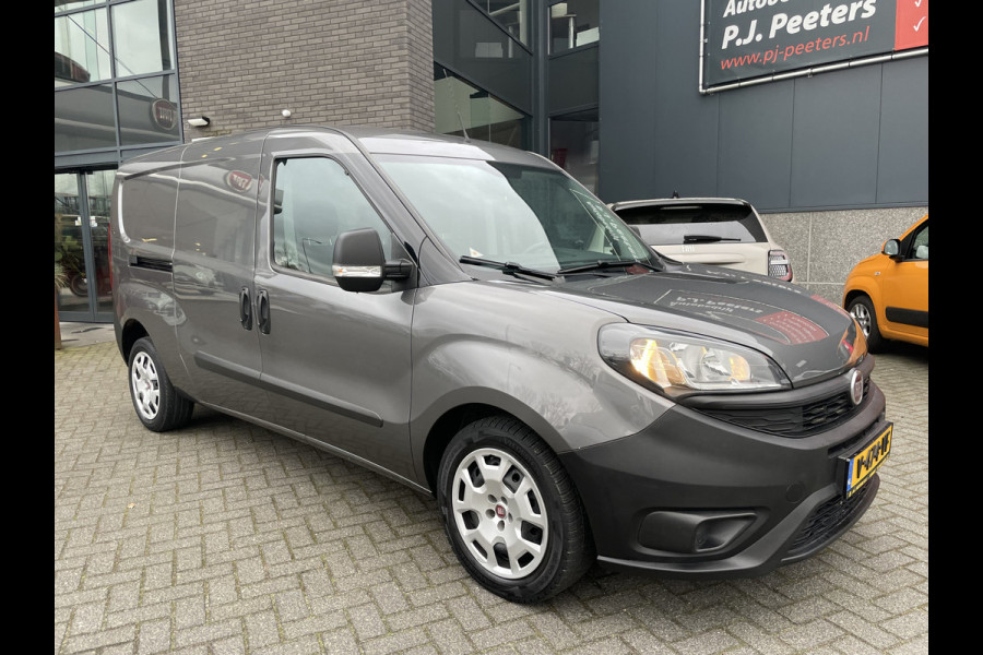 Fiat Doblò Cargo 1.6 MJ L2H1 Maxi Airco - Achteruitrijcamera - Navigatie - Cruise control - 3 zitplaatsen - Zijschuifdeur rechts - Tussenschot volledig - Elektrische ramen voor - Bluetooth - Stuur multifunctioneel - Radio