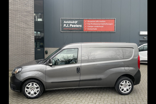 Fiat Doblò Cargo 1.6 MJ L2H1 Maxi Airco - Achteruitrijcamera - Navigatie - Cruise control - 3 zitplaatsen - Zijschuifdeur rechts - Tussenschot volledig - Elektrische ramen voor - Bluetooth - Stuur multifunctioneel - Radio