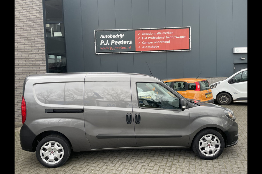 Fiat Doblò Cargo 1.6 MJ L2H1 Maxi Airco - Achteruitrijcamera - Navigatie - Cruise control - 3 zitplaatsen - Zijschuifdeur rechts - Tussenschot volledig - Elektrische ramen voor - Bluetooth - Stuur multifunctioneel - Radio